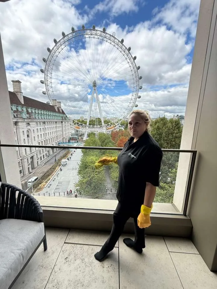 Dani on a balcony overlooking the London Eye